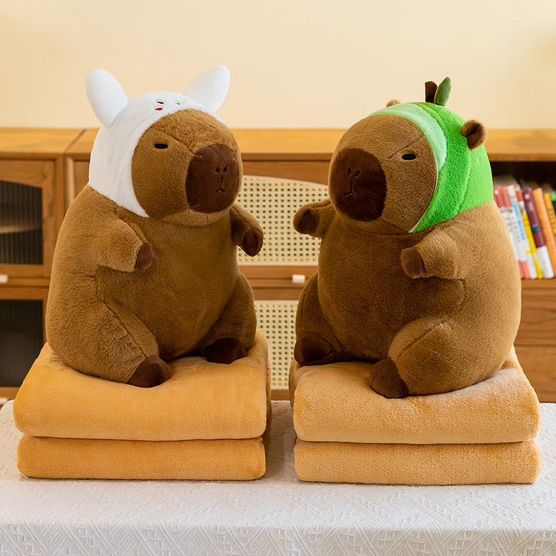 Caricatura capibara almohada manta dos en uno Carpibara cojín aire acondicionado es de doble uso niños siesta manta regalo