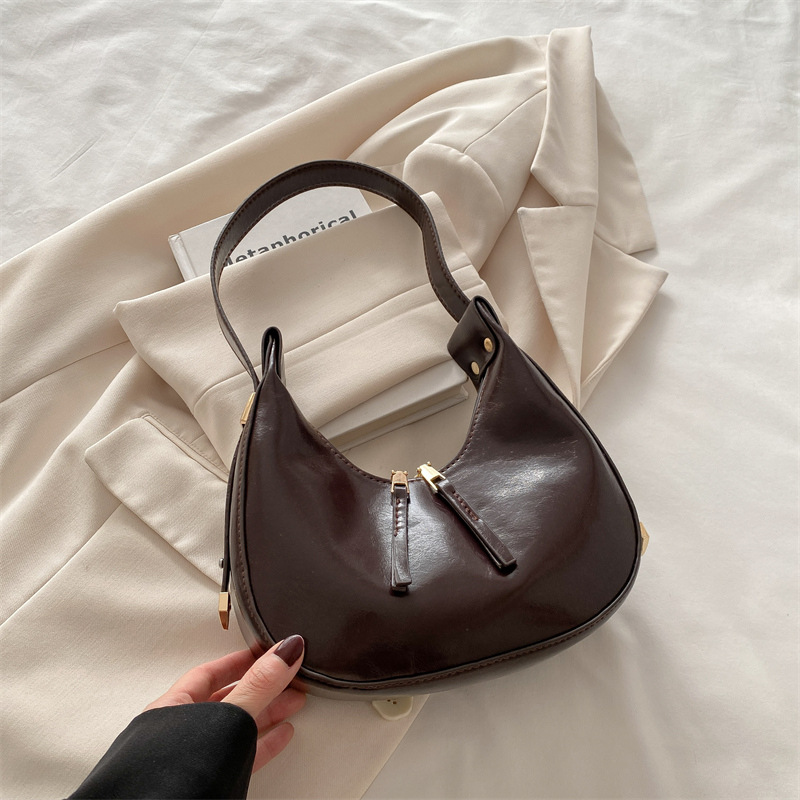 Estilo coreano ins 2025 primavera y verano nuevo diseño de nicho celebridades de Internet damas con un solo hombro y axilas albóndigas paquete de medio mes