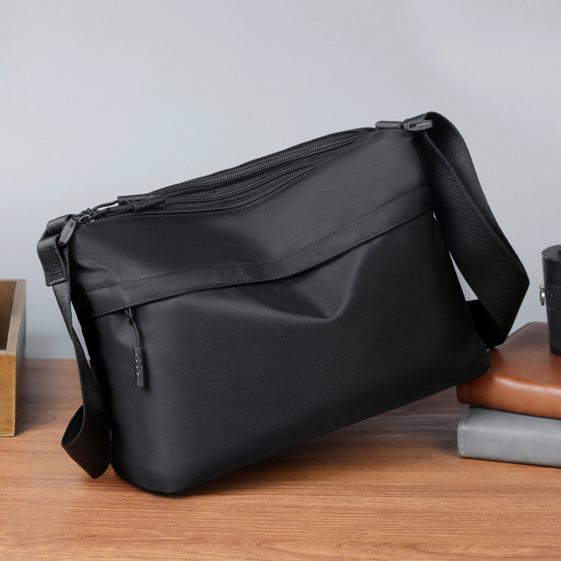 Simple and lightweight men's crossbody bag, versatile for casual outings and commuting, multi-compartment, large-capacity, stylish men's bag
