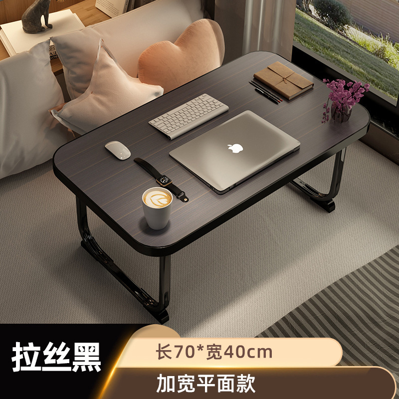 ベッドの上の机は折りたたみます。|undefined