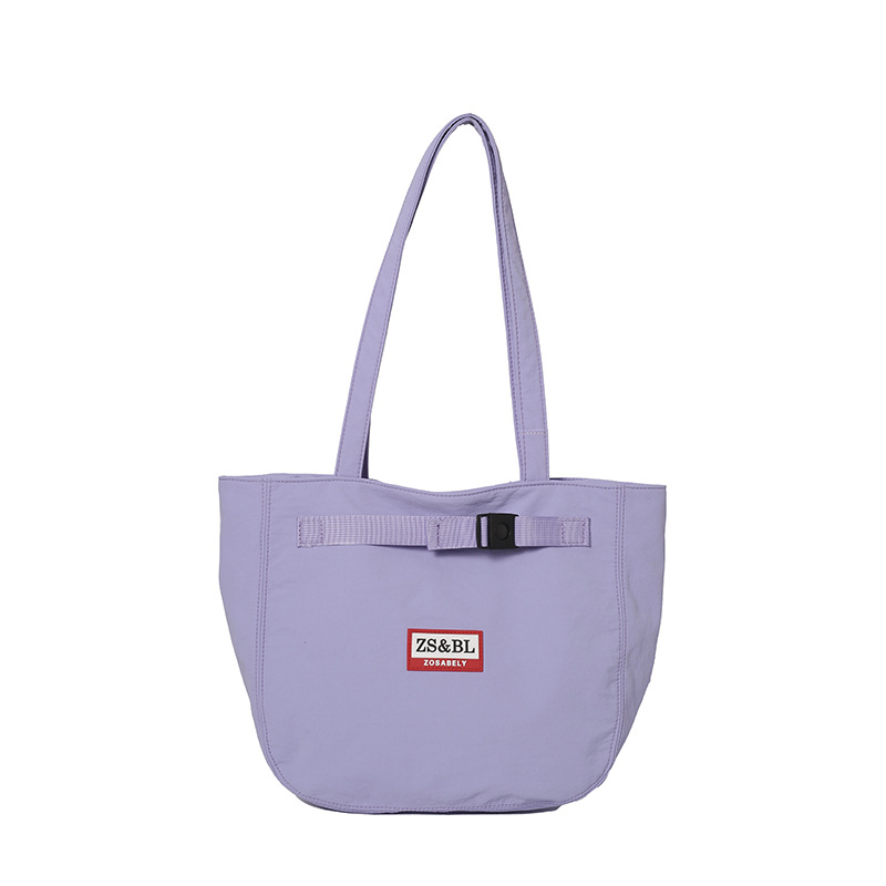Bolso de letras coreanas 2025 verano nuevo bolso femenino bolso de lona para estudiantes bolso de hombro casual de gran capacidad