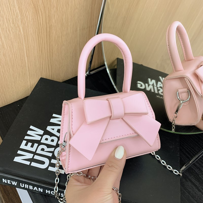 Bolso de mujer 2025 tendencia de primavera nuevo arco de moda para niños bolso de hombro de estilo extranjero bolso de mano