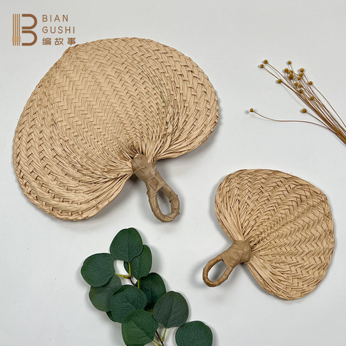 Rustic-style natural palm-leaf woven fan for summer cooling and mosquito repellent—large, handcrafted, and perfect for a gentle breeze.