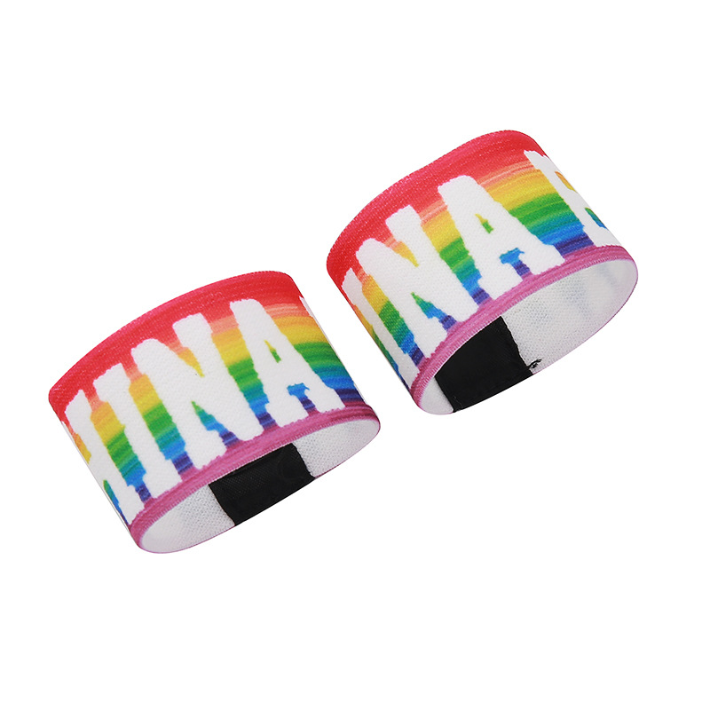 A pair of rainbow Chinababy wristbands