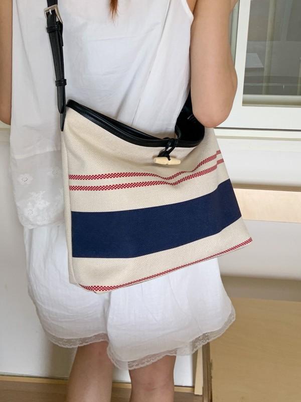 Bolso mujer 2025 nuevo bolso de cubo a rayas simple moda bolso de hombro casual de alta gama bolso de mensajero casual