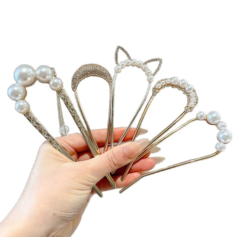 Perla de alta sensación en forma de U abrazadera de cabello bola de cabello fija abrazadera de cabello nuevo peine de cuatro dientes joyas al por mayor