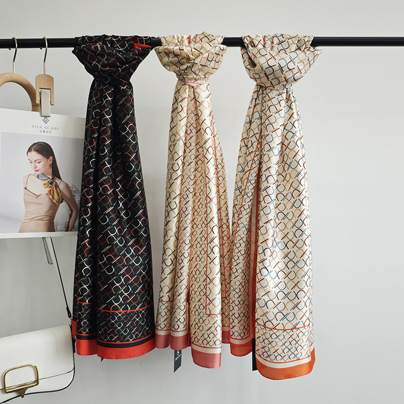 Pañuelo de seda estampado de temperamento elegante para mujer, protector solar de playa de alta gama, nueva bufanda de satén de seda, chal de habitación con aire acondicionado fino de verano