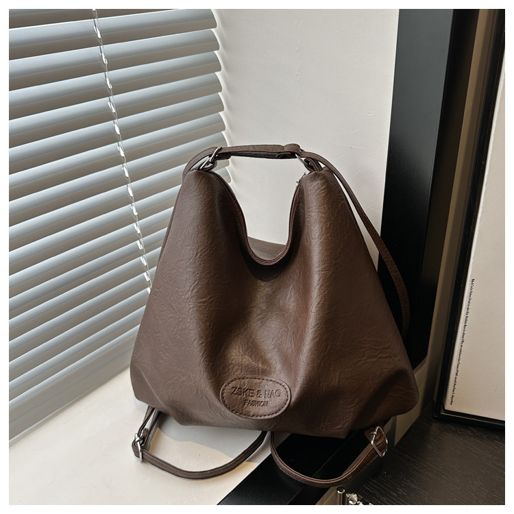 The 2024 new pleated tote bag is a large-capacity casual and fashionable backpack for women, featuring multi-functional texture and a single-shoulder crossbody bag undefined