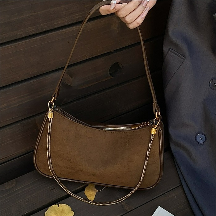 Corea del Sur de cuero de seda bolsos de mano bolsos de mano mujeres 2025 nueva moda cadena de hombro mochila bolsos de palo