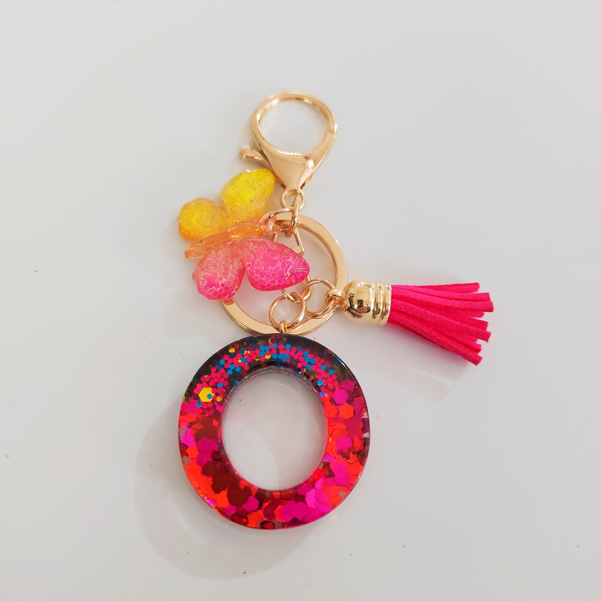 Ventas transfronterizas calientes de letras inglesas de color mixto colgante de llavero colgante de mariposa fringe de resina de llavero colgante de joyería