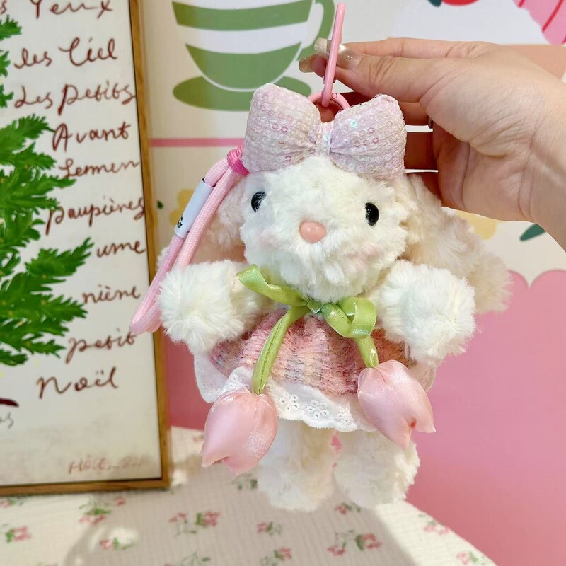 新商品の桜の耳を垂れたウサギのカバンのペンダントのぬいぐるみのキーホルダーはクリスマスプレゼントを飾ります。|undefined