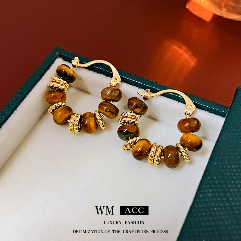 Oro Real electrochapado redondo Ojo de Tigre Piedra Oído hebilla de otoño e invierno pendientes de moda retro elegante alto sentido pendientes de fábrica al por mayor