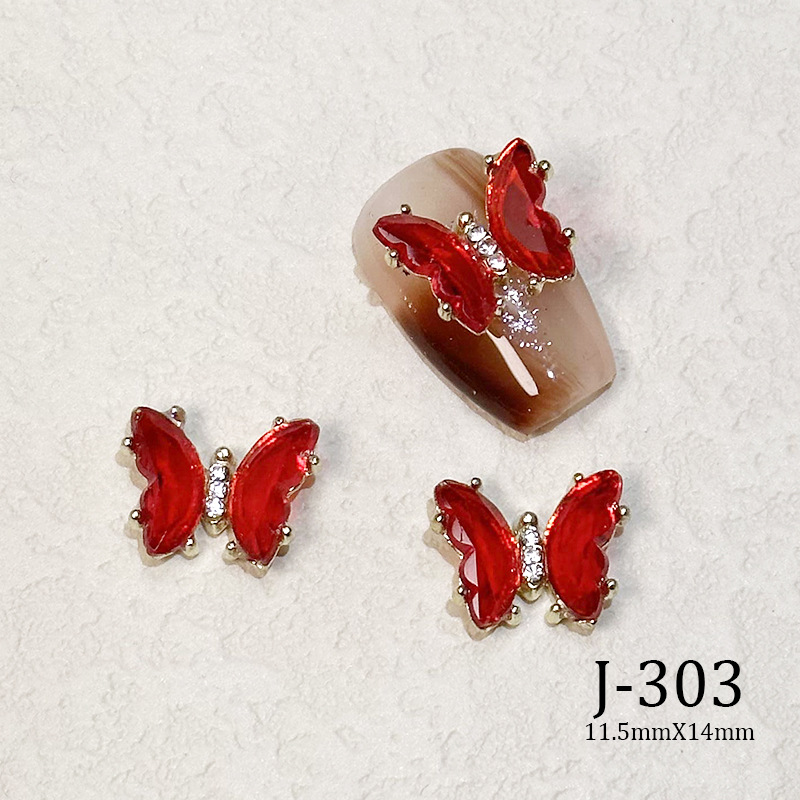2023 Nueva joyería de uñas Año nuevo rojo aleación conejo rojo mariposa de cristal pintura en aerosol arco accesorios de diamantes de uñas