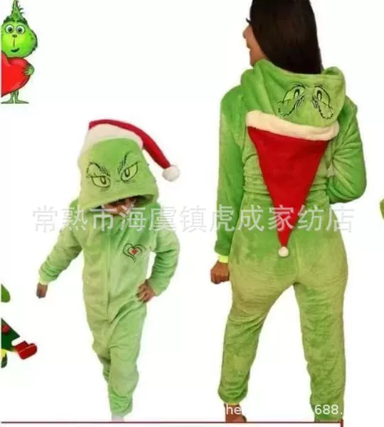 Green furry monster in santa hat