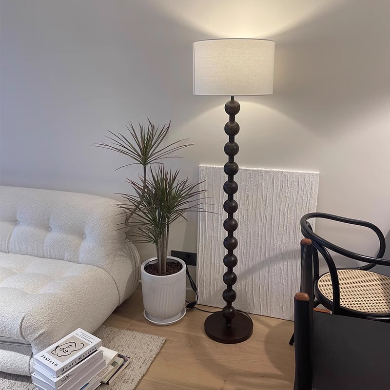 American floor lamp beside Japanese-style living room sofa, Bauhaus-style mid-century bedroom Wabi-sabi atmosphere light luxury standing lamp