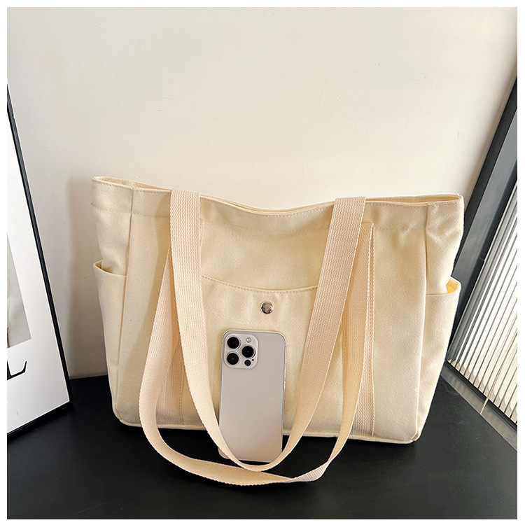 Wholesale of new women's single-shoulder bags, cross-border simple and casual canvas bags, Korean version LOGO printed commuter tote bags undefined
