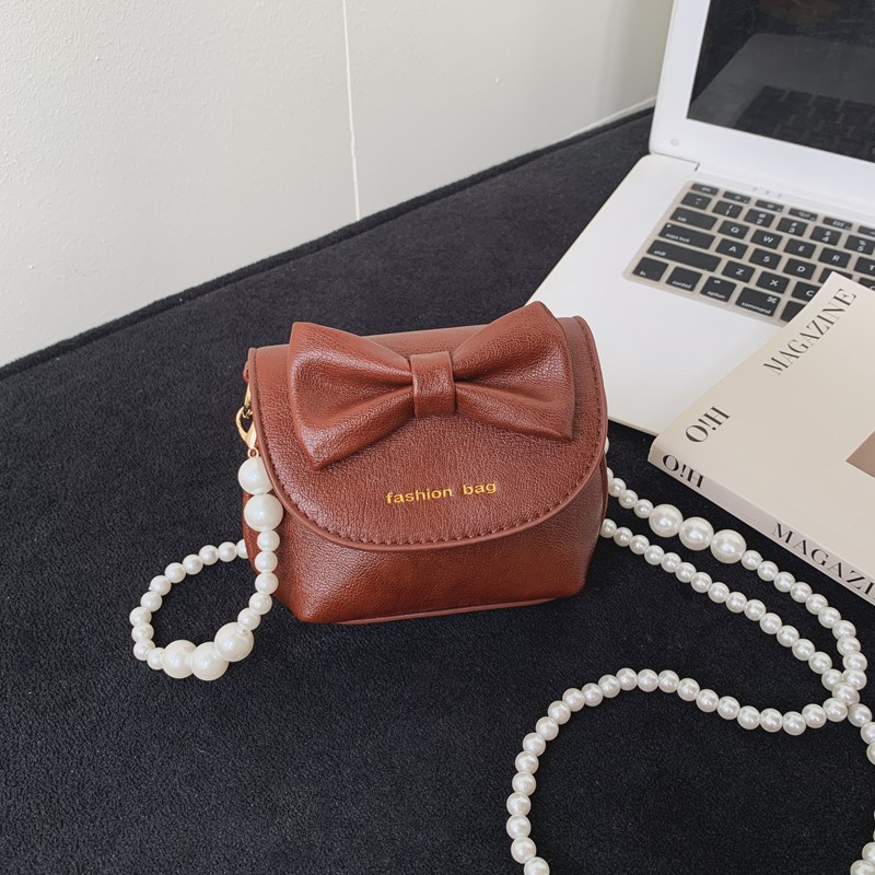 Cute mini niñas bolso de hombro dulce perla bolso de bebé coreano nuevo bolso de cambio de color sólido para niños