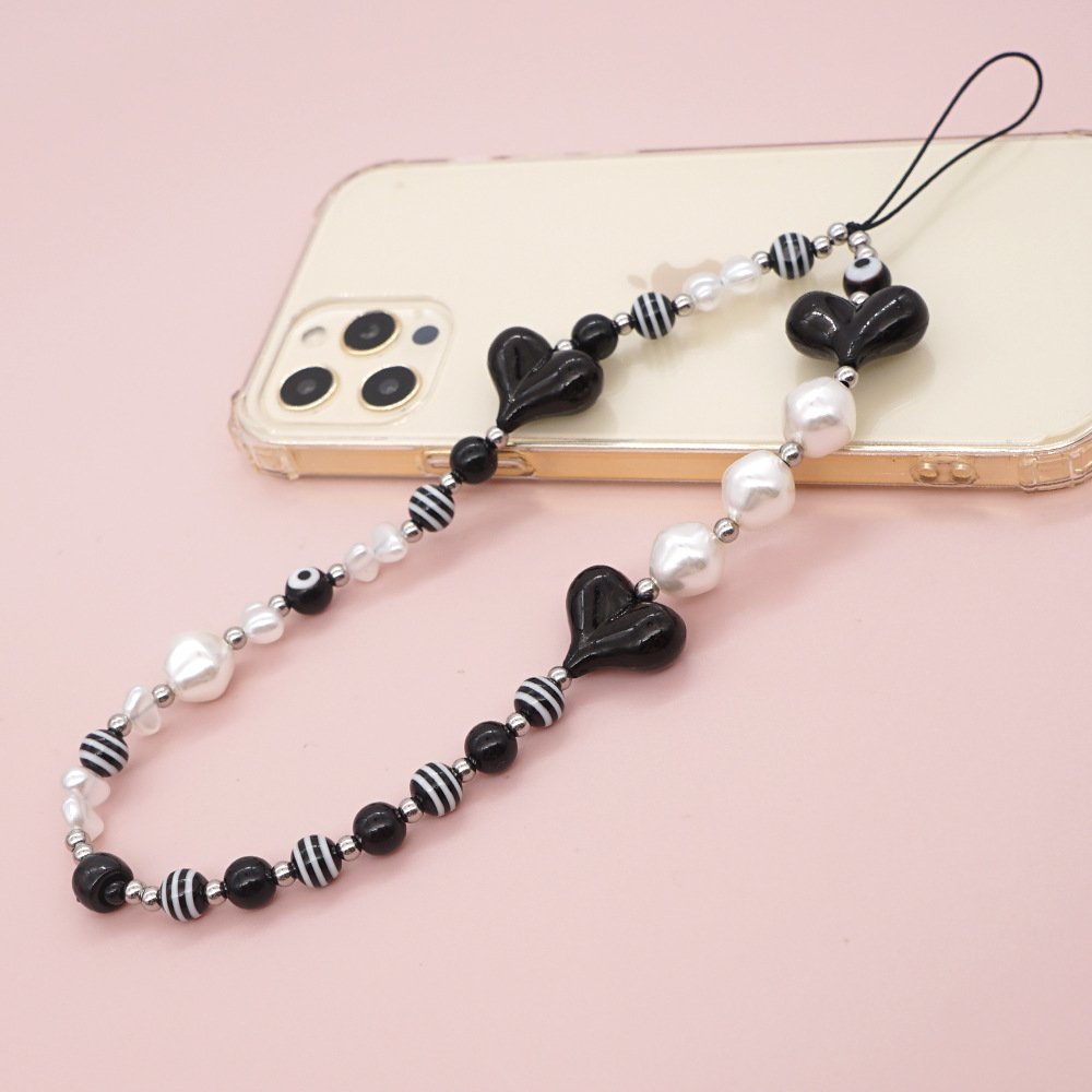 Estilo Étnico Negro En Forma De Corazón A Rayas De Cuentas Redondas Correa De Teléfono Móvil Venta Al Por Mayor Nihaojewelry display picture 7