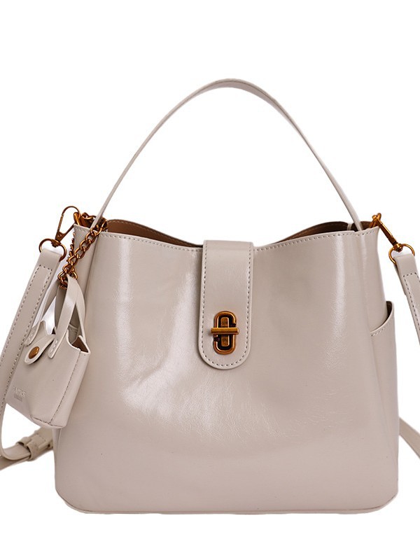 Bolsa portátil de cuero de cera retrógrada para mujeres 2026 nueva sensación de lujo ligera de alta calidad de moda versátil mochila de hombro
