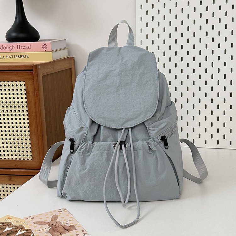 新款韩国小众轻便尼龙双肩包女休闲时尚抽绳旅行大容量背包男