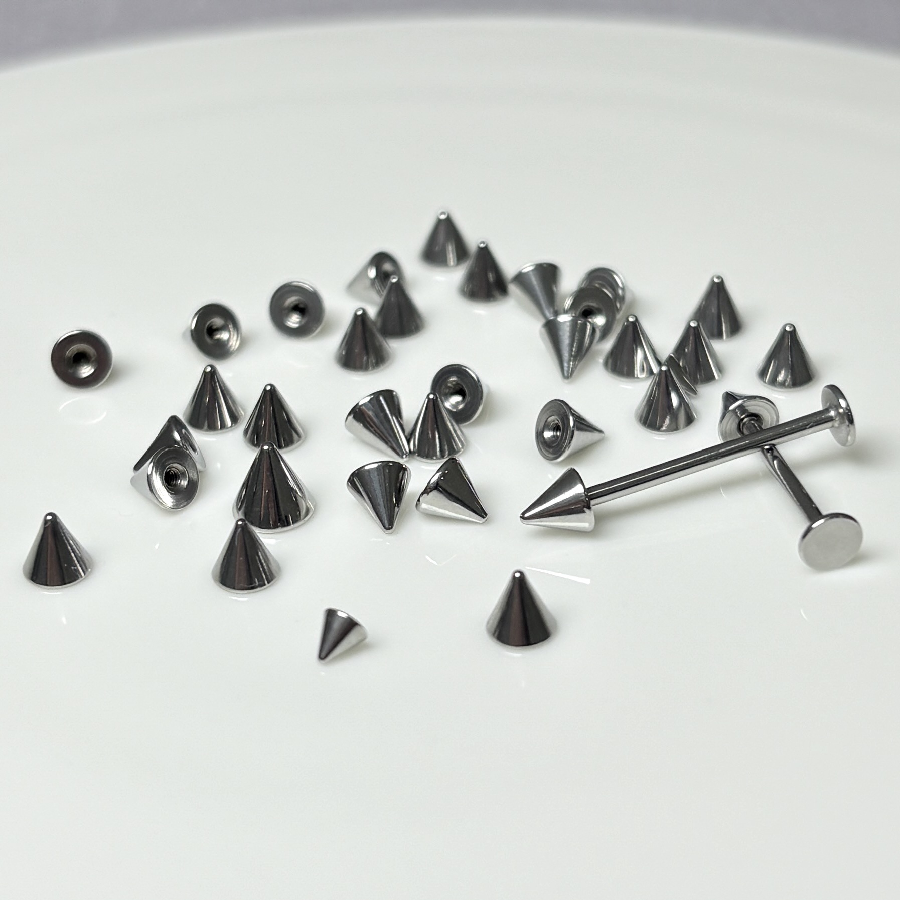 Silver pointed spike labret stud material detail