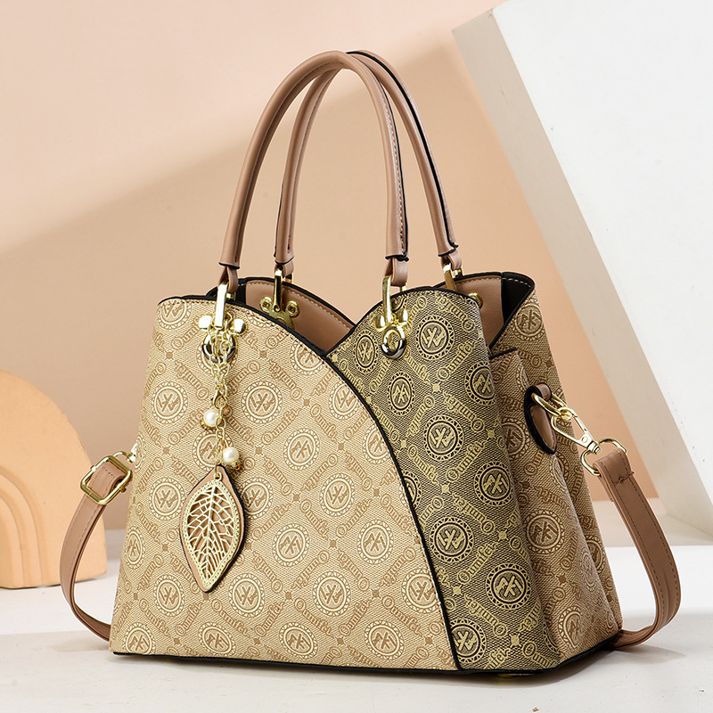 2025 verano nuevo bolso de moda de mediana edad bolso de mujer bolso de hombro mochila atmósfera bolso de madre universal