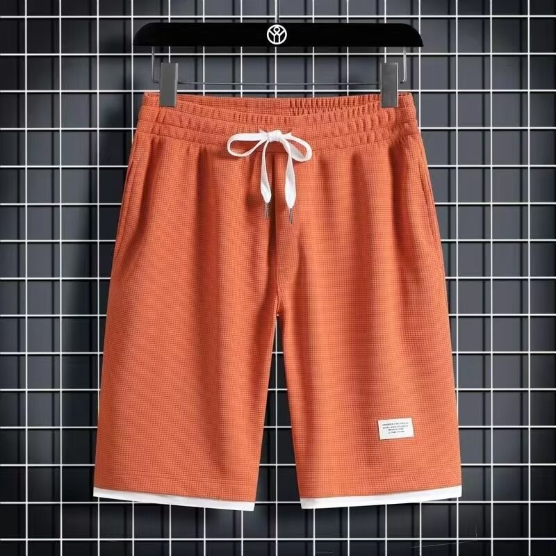 Camisa menos ropa Waffle pantalones de cinco puntos para hombres verano nuevo estilo estilo Hong Kong pantalones cortos de dos piezas falsos de color recto suelto