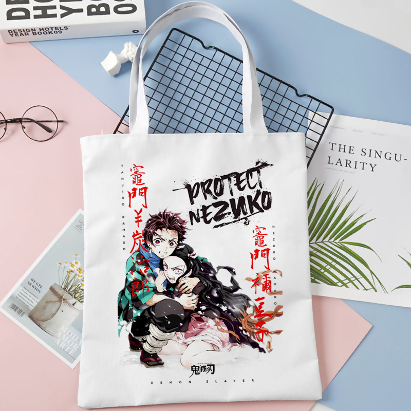 Comercio exterior transfronterizo Demon Slayer impresa bolsa de lona Harjuku bolsa de hombro bolsa de compras portátil de moda para estudiantes