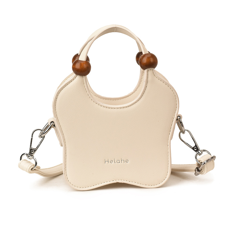 Bonita pequeña estrella en forma de bolso de hombro para niños y niñas, exquisita mini bolso de bebé, bolso para niños de comercio exterior transfronterizo