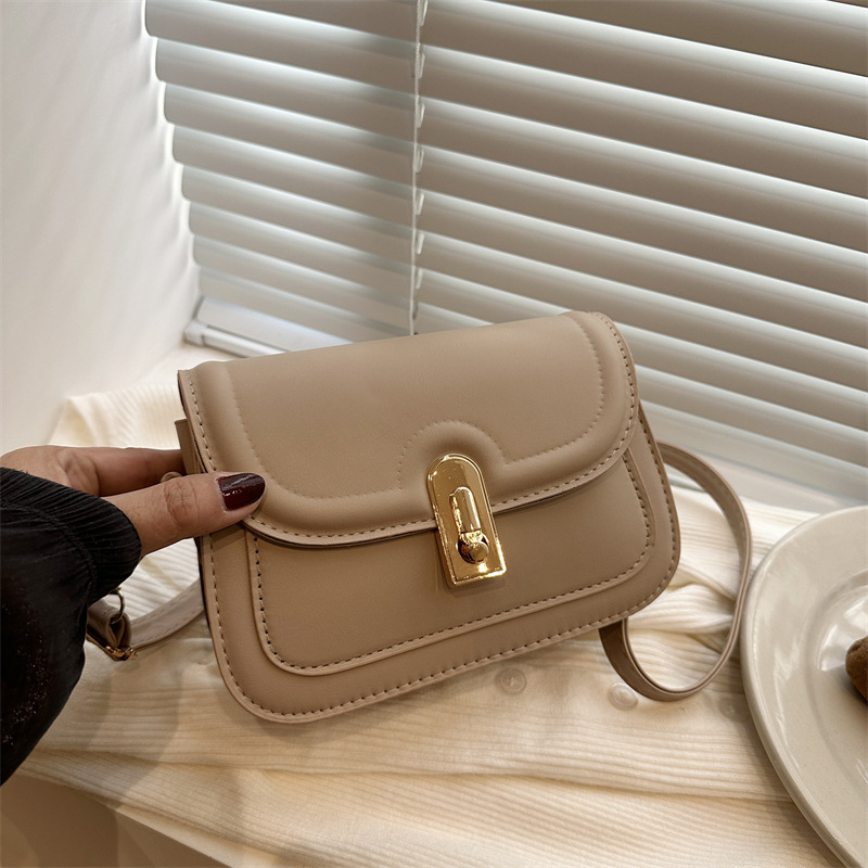 Bolsa feminina com fecho em estilo vintage, nova bolsa de ombro para outono/inverno 2024, alto valor estético, simples e adequada para o dia a dia._voghion.com