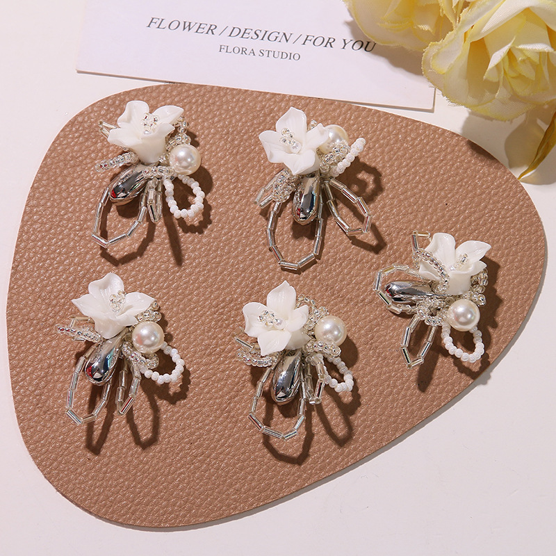 White small design sophisticated fashionable earrings