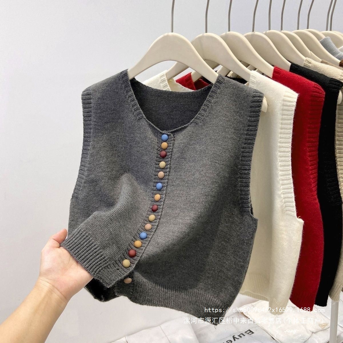 High-end gray knitted vest for women, spring 2026 trendy rainbow button vest layered with cardigan sweater.