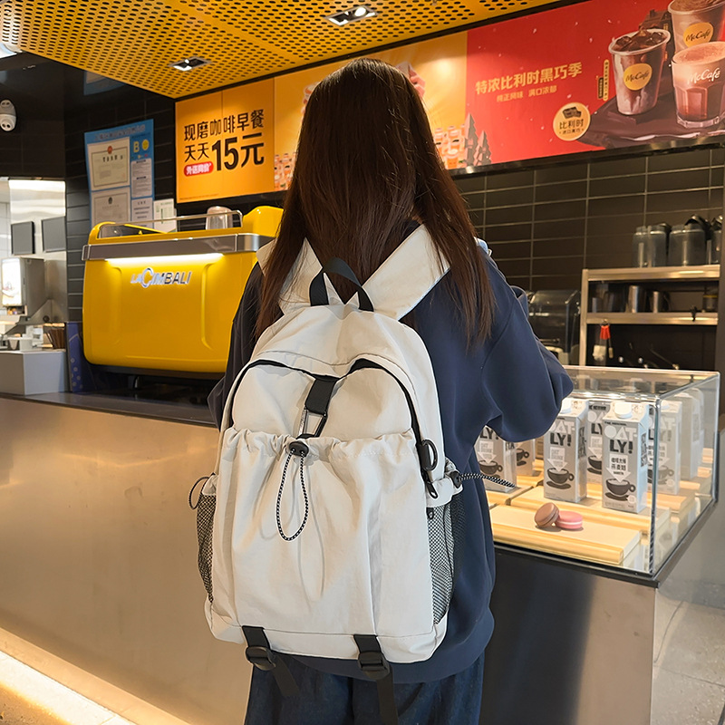 Mochila femenina casual de todo fósforo de nuevo estilo para estudiantes de secundaria y preparatoria, mochila escolar de reducción de carga de gran capacidad, mochila de viaje simple