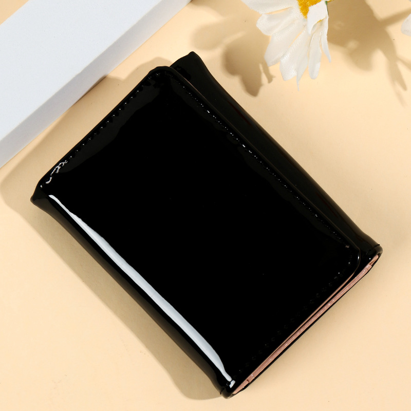 Versión coreana de la nueva personalidad simple moda color sólido gradiente láser triple clip de hierro multifuncional estudiante billetera corta mujer