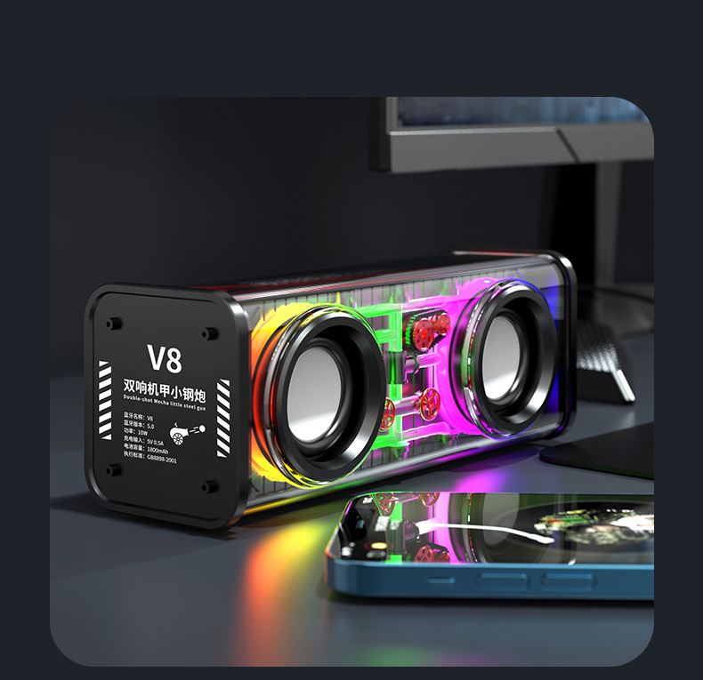 クロスボーダーv 8機甲bluetoothスピーカーv 9小型機甲携帯型サブウーファが手に持っています。|undefined
