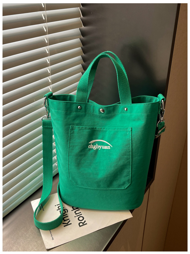 Bolso de mano de gran capacidad para mujeres 2026 verano nuevo estilo coreano simple mochila de hombro de viaje bolsa de ocio