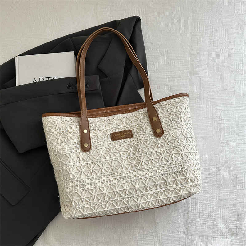 Bolso de moda de gran capacidad tejido 2025 verano de alto valor salvaje bolso de axila de un solo hombro bolso de mujer