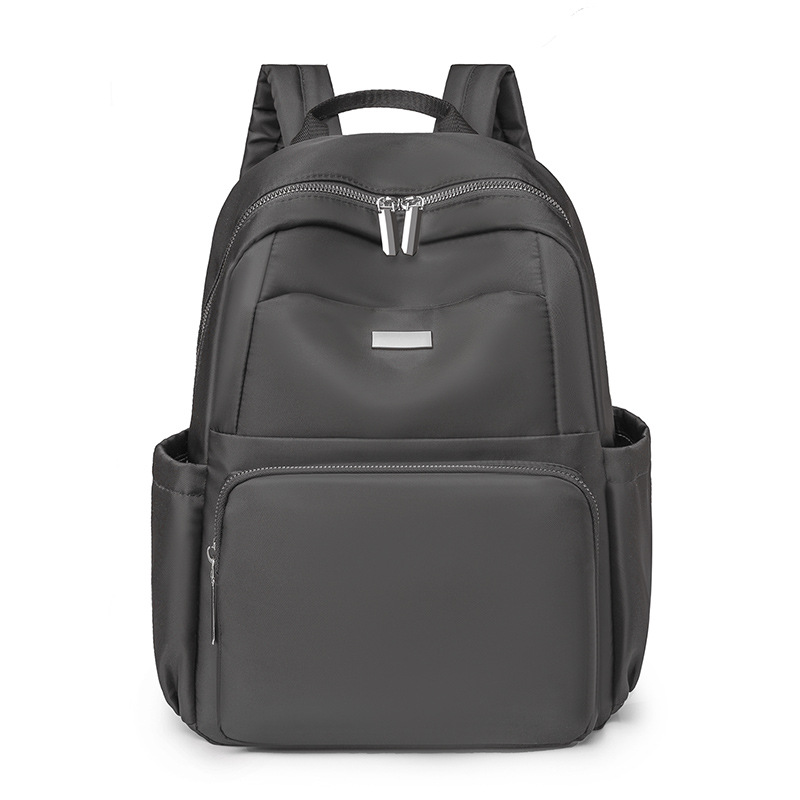 2024 verano nuevo estilo casual damas mochila de nailon simple y versátil mochila de computadora de gran capacidad para estudiantes al por mayor