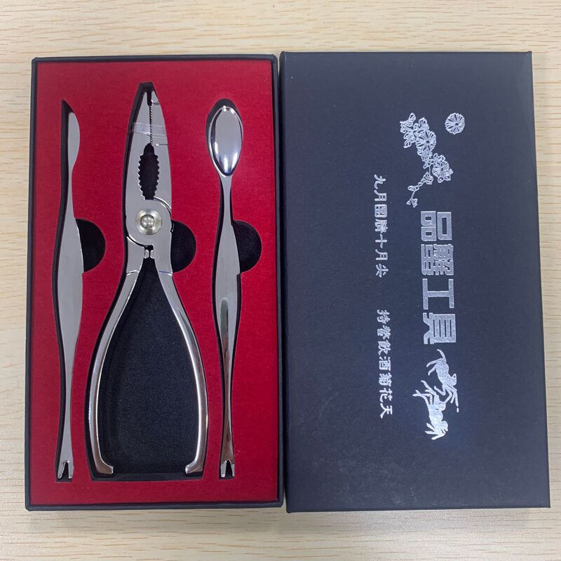 工場の現物のステンレスのカニのはさみの工具の2セットの海鮮のレストランはカニの用具のホテルのカニのスプーンを食べて卸売りします。|undefined