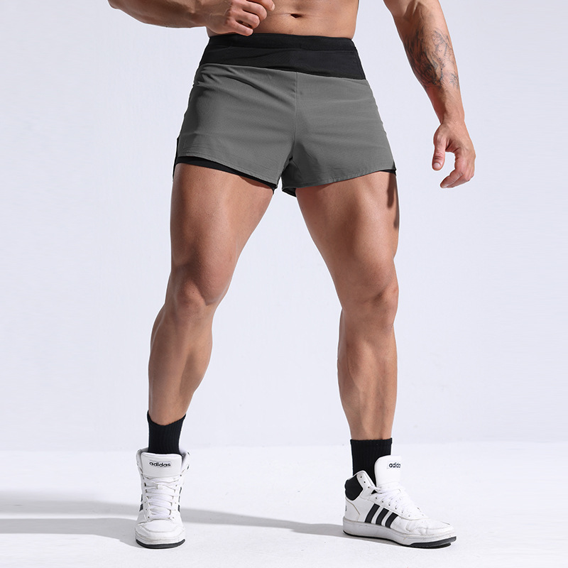 Comercio exterior transfronterizo europeo y americano verano fino correr pantalones cortos deportivos de secado rápido entrenamiento de maratón fitness de secado rápido para hombres de tres puntos