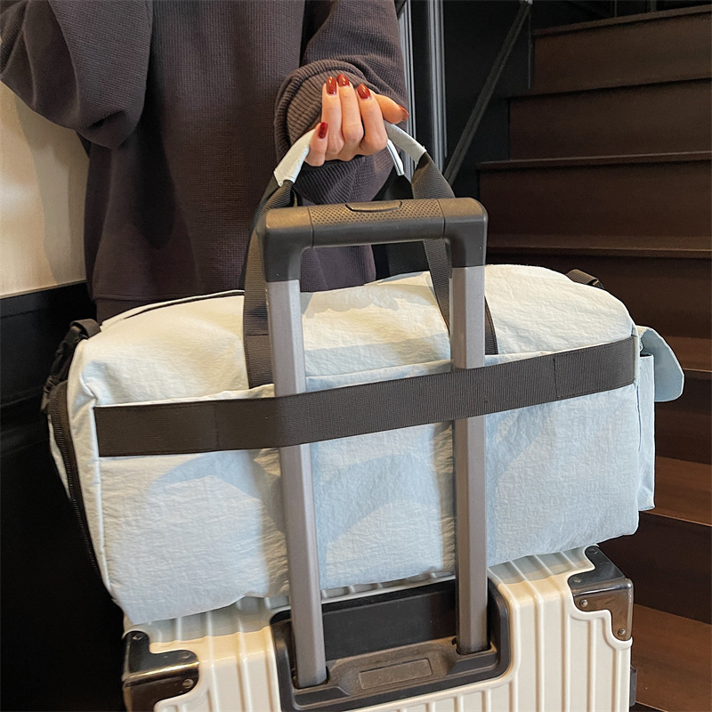 Bolso deportivo coreano transfronterizo femenino 2025 nueva bolsa de almacenamiento separada seca y húmeda bolsa de viaje de viaje