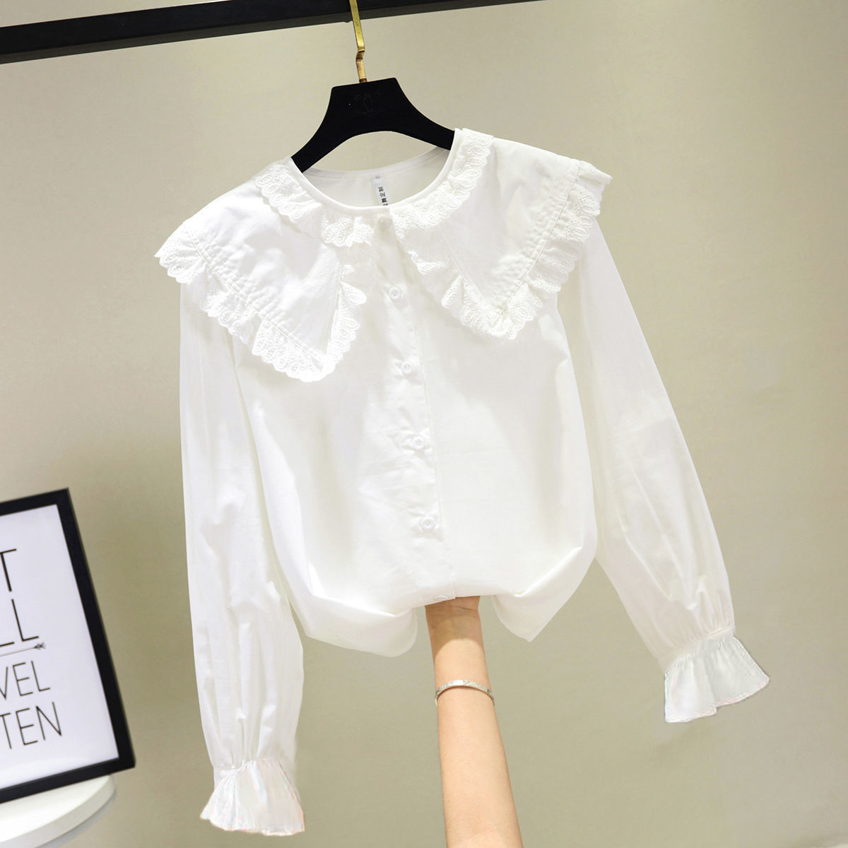 Camisa de primavera y verano para niñas 2023 nuevo estilo coreano estilo occidental camisa blanca de manga larga para niños collar de muñeca de encaje inferior superior
