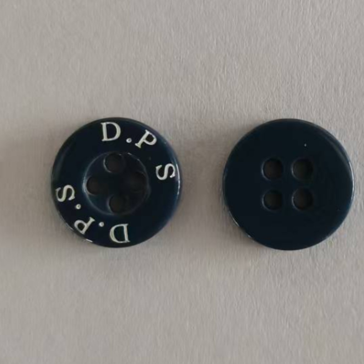 厂家供应纽扣扣子风衣纽扣树脂激光抹油钮扣高端男西装衣服大衣