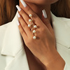 Fashionable trend golden ring from pearl, European style, on index finger