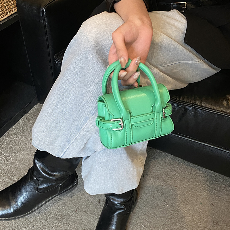 Bolsos de mano de chicas extranjeras de empalme de correa simple color sólido mini mochila 2026 nuevo estilo coreano bolsos para niños