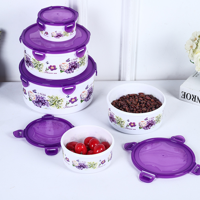 Caja redonda hermética para almacenamiento de alimentos, ideal para refrigerador, camping o uso doméstico.