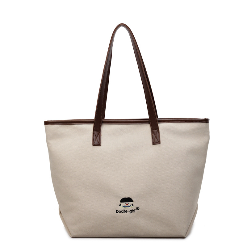 Bolsa de lona de gran capacidad para mujeres 2025 nuevo estilo urbano simple de viaje al trabajo sensación de alta calidad de moda versátil bolso de mano