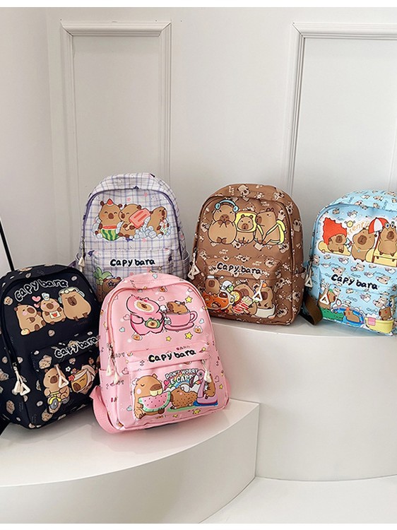 Nueva mochila de gran capacidad dibujos animados encantador impresión de estudiantes de primaria y secundaria reducción de presión de la espalda ocio versátil doble espalda