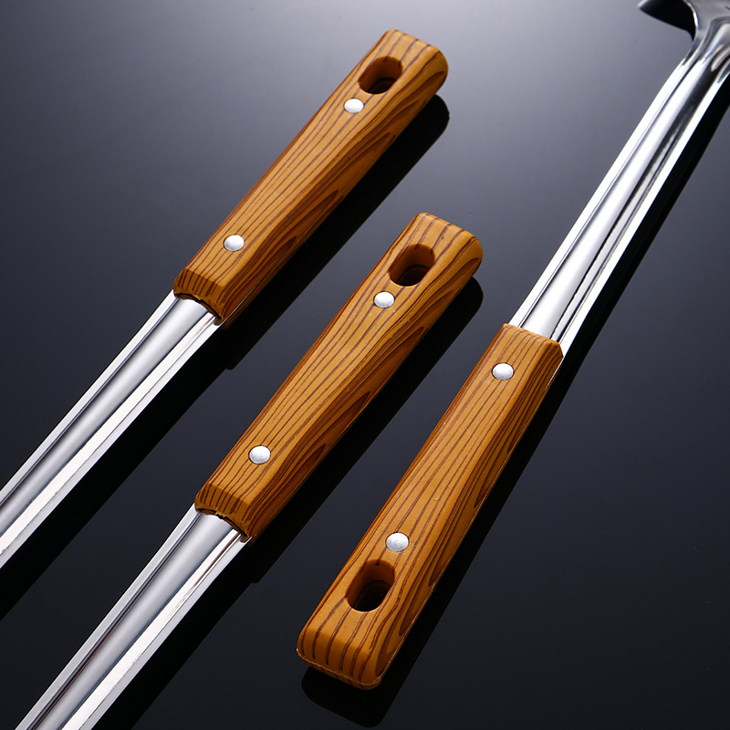 Juego de utensilios de cocina de acero inoxidable para cocinar aislamiento térmico engrosado mango de grano de madera espátula colador cuchara de sopa al por mayor utensilios de cocina domésticos