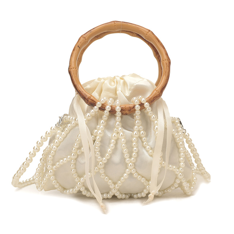 Nueva bolsa china de tejido para niños y niñas bolsas de hombro de perlas de bambú hueco bolsas de mano pequeñas bolsas de cuerda de dibujo para niños